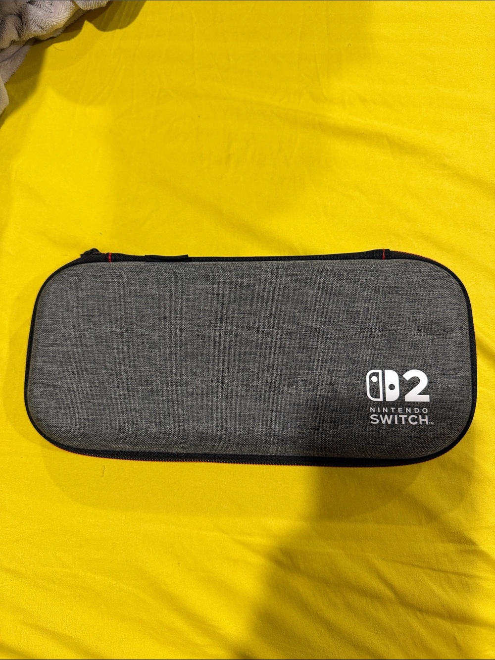 Black Portable Game Case with Red Stitch Accents